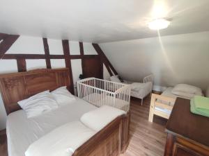 Postel nebo postele na pokoji v ubytování Maison de Campagne-Au Petit Bois de la Gravette