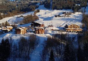 an aerial view of a resort in the snow at Chalets des Evettes- appartement vue montagne in Flumet