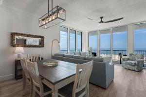 a living room with a table and a couch at Perdido Dunes Tower 3E in Orange Beach
