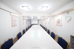 a conference room with a long table and chairs at Hotel Lebed in Ohrid