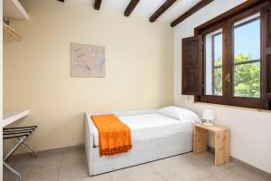 a bedroom with a bed and a window at Fiore di Vendicari B&B - Sicilian Charme, Lemon Grove and Sea in Noto