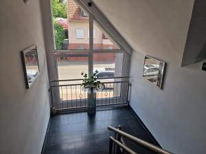 a staircase with a vase with a plant in it at The Ferienwohnung in Bremen