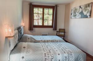 Postel nebo postele na pokoji v ubytování Gîte Peyré - Michel & Geneviève