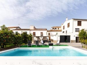 an exterior view of a house with a swimming pool at Casa huerta maria in Chite