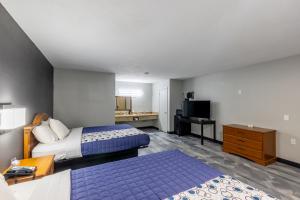Postel nebo postele na pokoji v ubytování Freer Executive inn and Studios