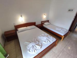 Postel nebo postele na pokoji v ubytování Estelle Hotel