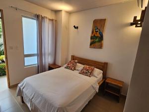 Postel nebo postele na pokoji v ubytování Hotel La Ensenada Necocli + 41 fotografií