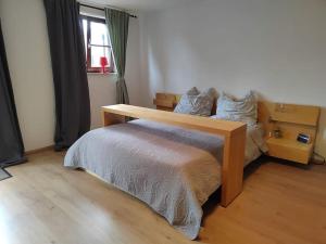 Ένα ή περισσότερα κρεβάτια σε δωμάτιο στο Ferienwohnung Hohes Venn