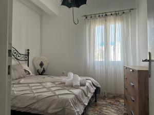 Postel nebo postele na pokoji v ubytování Casa Vista Panoramica