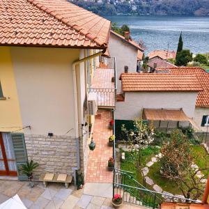 a house with a view of the water at Casa Gelsomino, Laglio, Lake Como in Laglio