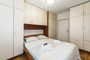 Кровать или кровати в номере Meta Olive apartment