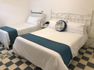 Una cama o camas en una habitación de Villa Vicuña Hotel Boutique