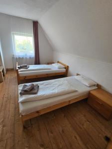 Llit o llits en una habitació de Ferienwohnung PETER