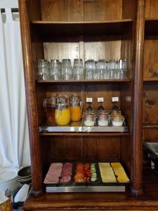 a cabinet filled with lots of different types of food at Hotel Skógá by EJ Hotels in Skogar