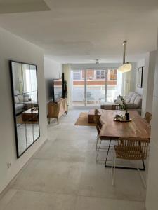 a living room with a table and a couch at Boutique Apartment Torrevieja Centro in Torrevieja