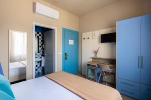 Postel nebo postele na pokoji v ubytování Hotel Nina