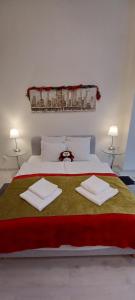 Posteľ alebo postele v izbe v ubytovaní Palace Apartment
