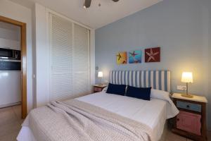 Postel nebo postele na pokoji v ubytování UHC Cye Apartments