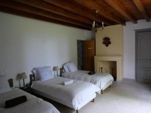 Postel nebo postele na pokoji v ubytování La maison de Maitre Meunier
