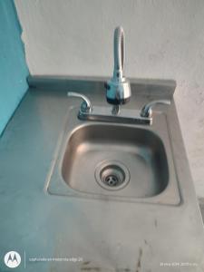 a sink with a faucet on top of it at Hidden Island Glamping Isla Mujeres in Isla Mujeres