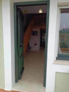an open door to a hallway in a house at Seaside Apartments 1 in Emborios Kalymnos