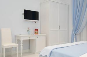 TV a/nebo společenská místnost v ubytování Domus Rosa + 27 fotografií