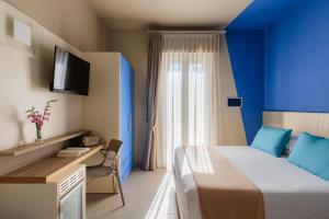 Postel nebo postele na pokoji v ubytování Hotel Nina