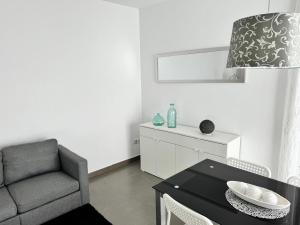 Posezení v ubytování APARTAMENTO ROMELIA 1ºa
