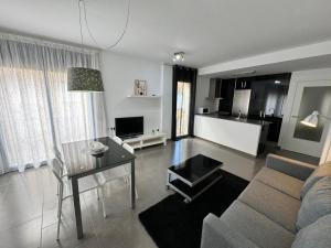 TV a/nebo společenská místnost v ubytování APARTAMENTO ROMELIA 1ºa
