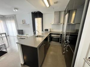 Kuchyň nebo kuchyňský kout v ubytování APARTAMENTO ROMELIA 1ºa