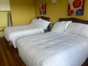 Postel nebo postele na pokoji v ubytování Hotel Motel Le Château