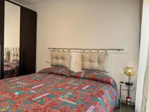 Postel nebo postele na pokoji v ubytování APARTAMENTO ROMELIA 1ºa