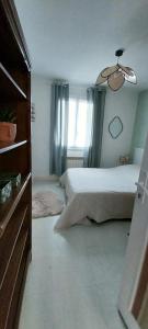 En eller flere senge i et værelse på La maison verte