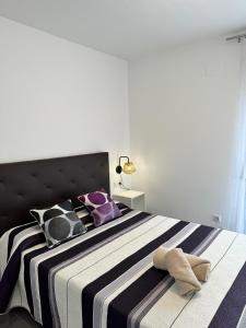 Postel nebo postele na pokoji v ubytování APARTAMENTO ROMELIA 1ºa