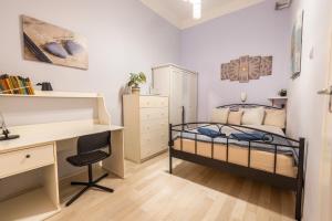 Posteľ alebo postele v izbe v ubytovaní Gellerico Rooms at Horánszky Street
