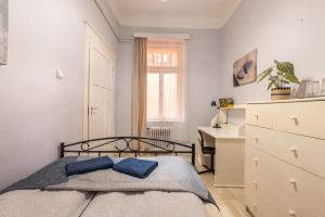Posteľ alebo postele v izbe v ubytovaní Gellerico Rooms at Horánszky Street