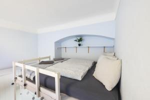 Posteľ alebo postele v izbe v ubytovaní Gellerico Rooms at Horánszky Street