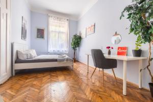 Posteľ alebo postele v izbe v ubytovaní Gellerico Rooms at Horánszky Street