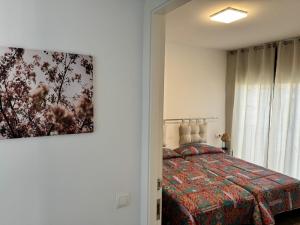 Postel nebo postele na pokoji v ubytování APARTAMENTO ROMELIA 1ºa