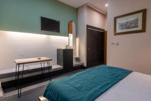 Letto o letti in una camera di Hotel Astra