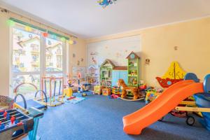 a play room with many different types of play equipment at Pokoje gościnne Przystań in Dębki