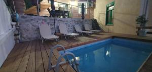 The swimming pool at or close to Chrisi Traditional House
