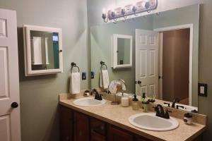 a bathroom with two sinks and a large mirror at Sea Largo in Navarre +51 photos