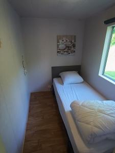 Postel nebo postele na pokoji v ubytování Camping les goélands