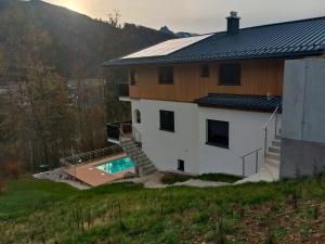 an aerial view of a house with a swimming pool at Salzkammergut View in St. Wolfgang
