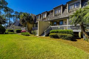 a house with a lawn in front of it at Harbour Town Club Villas 1253 in Hilton Head Island