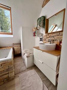 a bathroom with a sink and a mirror at Chalúpka in Stará Ľubovňa