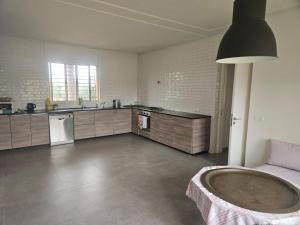 a large kitchen with a large tub in a room at Premium farmhouse with pool in Rabat