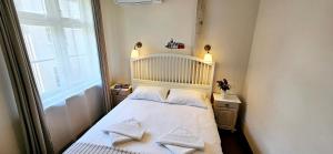 a small bedroom with a bed and a window at Villa Loebel 1881 in Juodkrantė +51 photos
