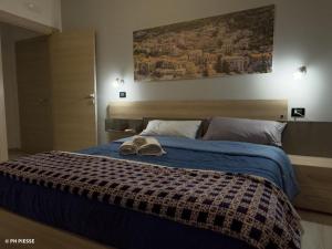 Ένα ή περισσότερα κρεβάτια σε δωμάτιο στο B&B Alba Chiara